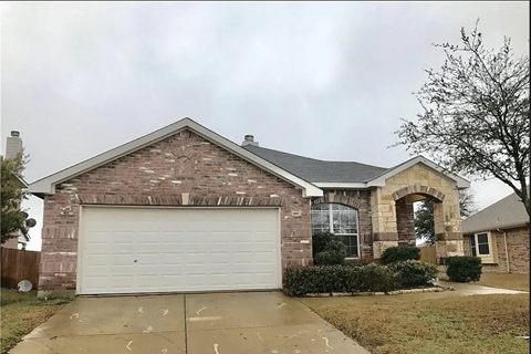 a house with a white garage door in front of it